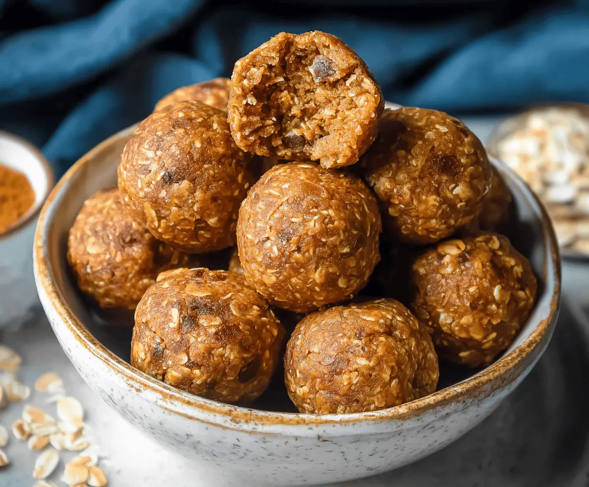 Healthy oatmeal pumpkin protein balls on a white plate, perfect for a nutritious snack or energy boost.