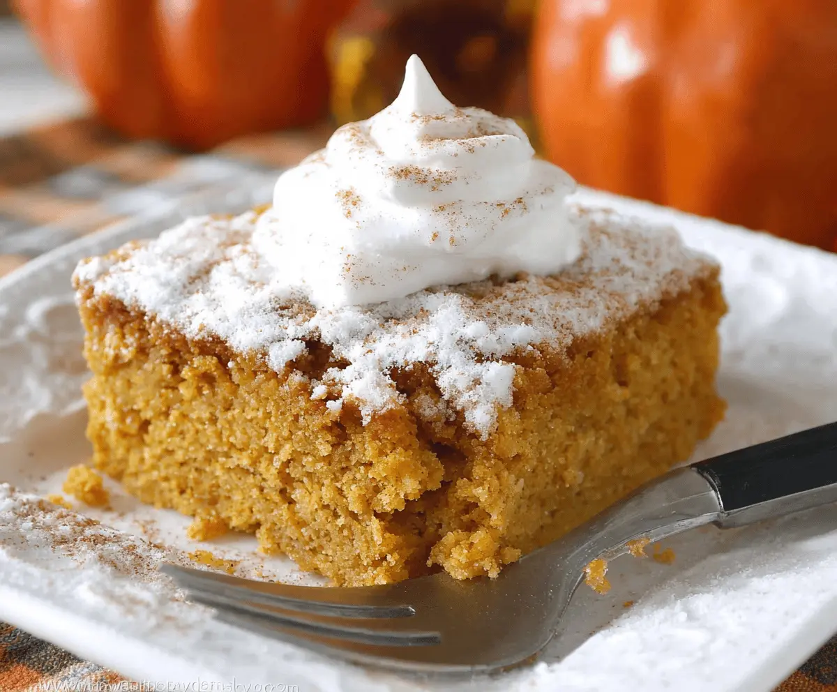 Delicious homemade Pumpkin 3 Ingredient Cake topped with whipped cream and cinnamon, perfect for fall desserts